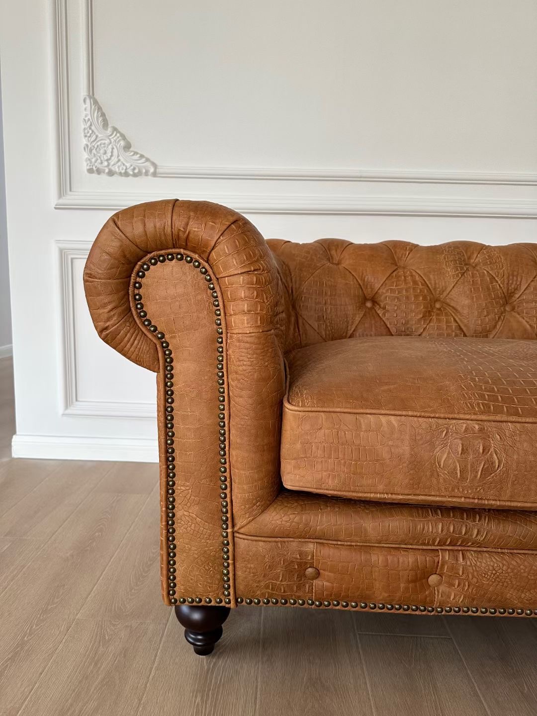Brown chesterfield sofa
